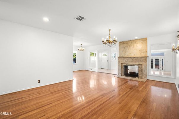 Chandelier, Empty room, Fireplace, Interior, Recessed Lighting, Wood Texture Flooring