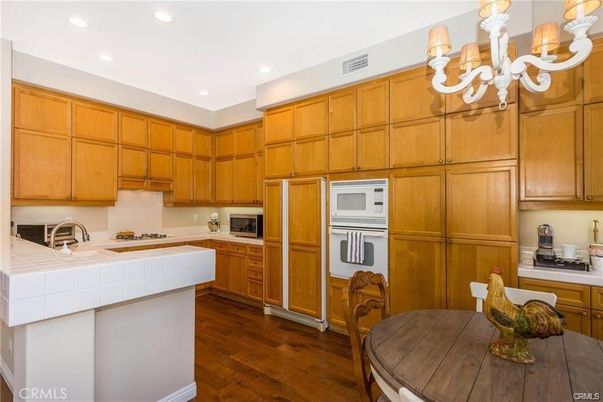Chandelier, Dining room, Interior, Kitchen, Recessed Lighting, Tile Countertops, Wood Texture Flooring