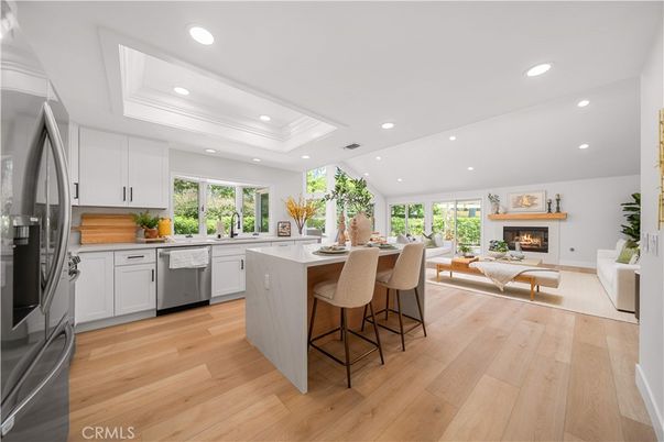 Fireplace, Interior, Kitchen, Living room, Recessed Lighting, Stainless Steel Appliances, Wood Texture Flooring