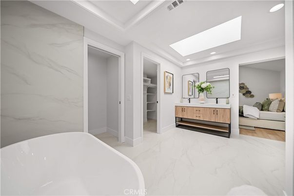 Bathroom, Bedroom, Dual Sink Vanities, Free Standing Baths, Interior, Marble, Marble Walls, Recessed Lighting