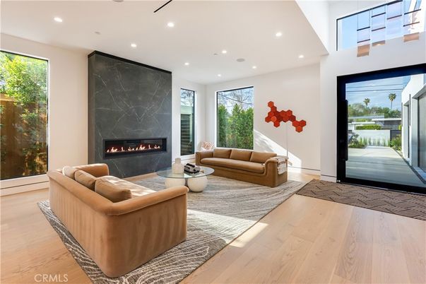 Fireplace, Interior, Living room, Marble Walls, Recessed Lighting, Wood Texture Flooring