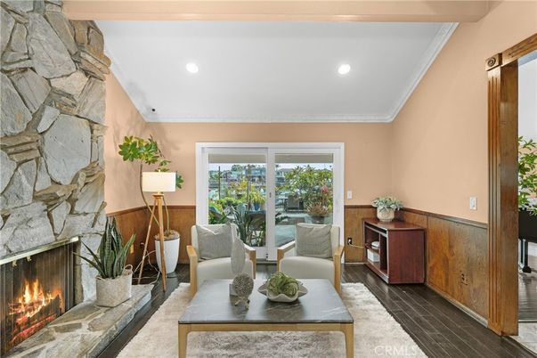 Fireplace, Interior, Living room, Recessed Lighting, Stone Walls, Wood Texture Flooring