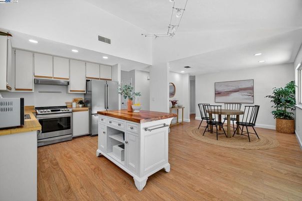 Dining room, Interior, Kitchen, Recessed Lighting, Stainless Steel Appliances, Wood Texture Flooring