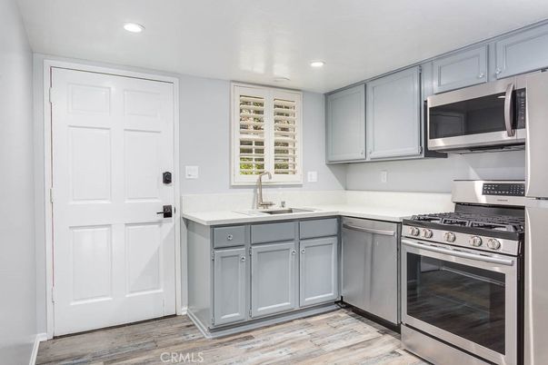 Interior, Kitchen, Recessed Lighting, Stainless Steel Appliances, Wood Texture Flooring
