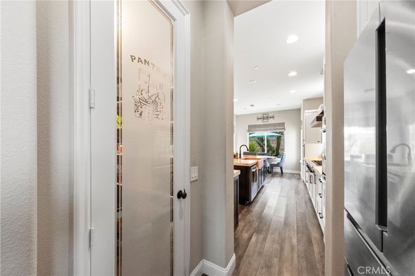 Dining room, Fireplace, Interior, Kitchen, Living room, Recessed Lighting, Stainless Steel Appliances, Wood Texture Flooring