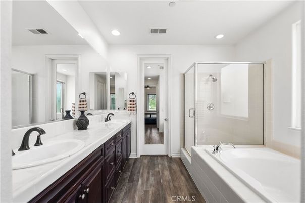 Bathroom, Dual Sink Vanities, Glass Shower, Interior, Recessed Lighting, Tile Countertops, Wood Texture Flooring