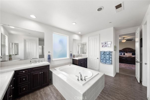 Bathroom, Bedroom, Dual Sink Vanities, Interior, Recessed Lighting, Wood Texture Flooring