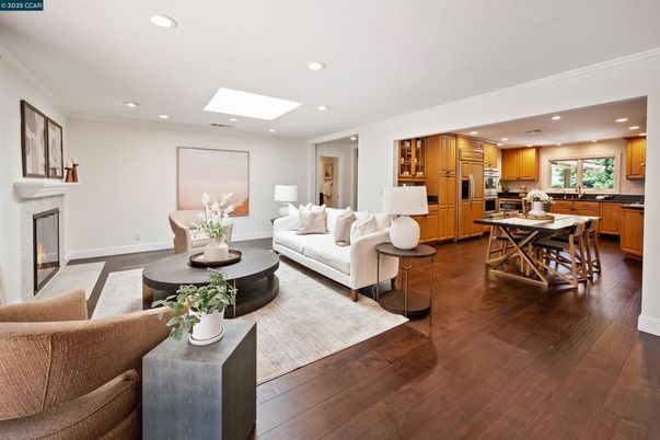 Dining room, Fireplace, Interior, Kitchen, Living room, Recessed Lighting, Stainless Steel Appliances, Wood Texture Flooring