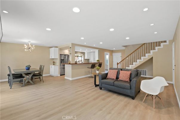 Chandelier, Dining room, Interior, Kitchen, Pendant Lights, Recessed Lighting, Stainless Steel Appliances, Wood Texture Flooring