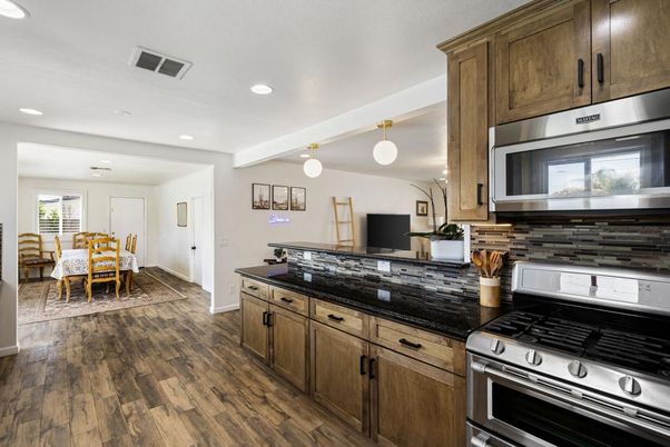 Dining room, Interior, Kitchen, Pendant Lights, Recessed Lighting, Stainless Steel Appliances, Wood Texture Flooring