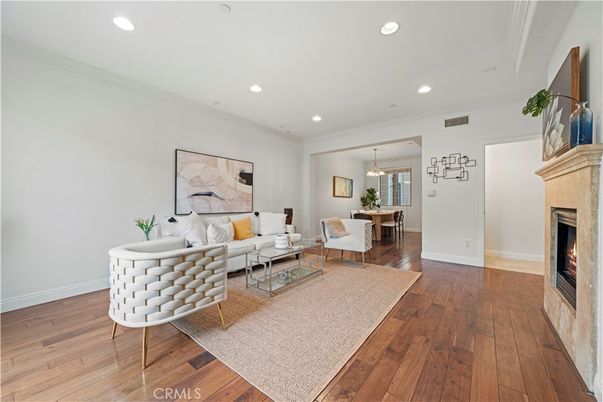 Dining room, Fireplace, Interior, Living room, Pendant Lights, Recessed Lighting, Wood Texture Flooring