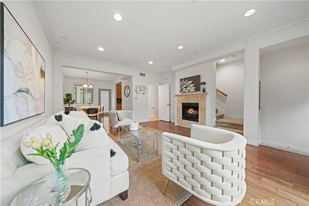 Dining room, Fireplace, Interior, Living room, Pendant Lights, Recessed Lighting, Wood Texture Flooring