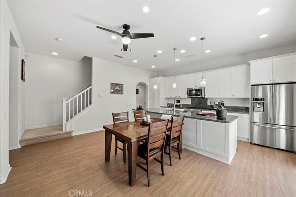 Dining room, Interior, Kitchen, Pendant Lights, Recessed Lighting, Stainless Steel Appliances, Wood Texture Flooring