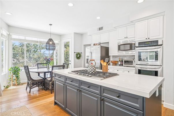 Dining room, Interior, Kitchen, Pendant Lights, Recessed Lighting, Stainless Steel Appliances, Wood Texture Flooring