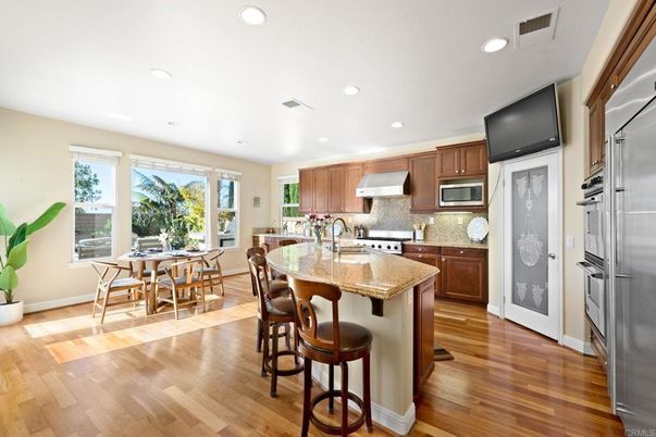 Dining room, Interior, Kitchen, Recessed Lighting, Stainless Steel Appliances, Wood Texture Flooring