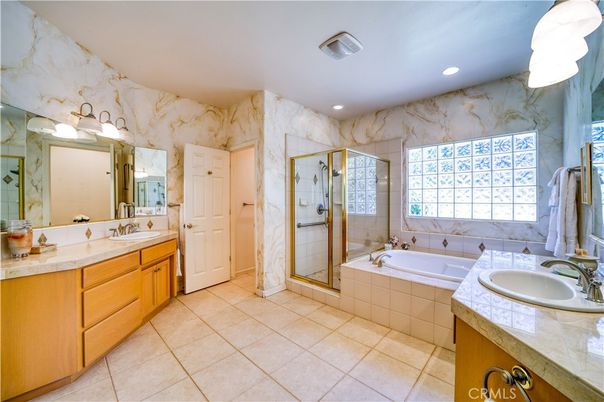 Bathroom, Dual Sink Vanities, Glass Shower, Interior, Marble Walls, Recessed Lighting, Tile Countertops