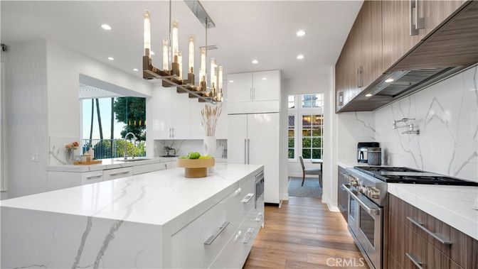 Interior, Kitchen, Marble Walls, Pendant Lights, Recessed Lighting, Stainless Steel Appliances, Wood Texture Flooring