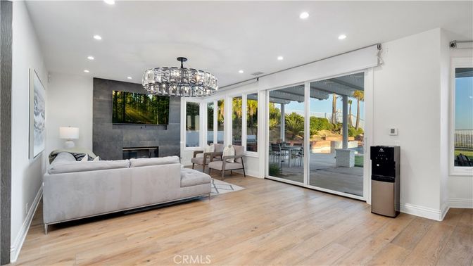 Chandelier, Fireplace, Interior, Living room, Recessed Lighting, Wood Texture Flooring