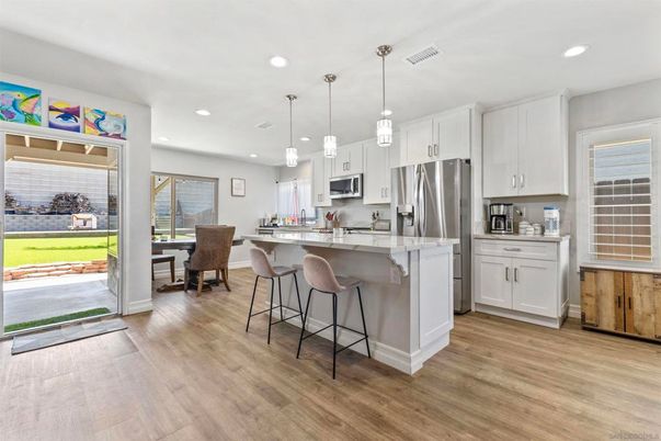 Dining room, Interior, Kitchen, Pendant Lights, Recessed Lighting, Stainless Steel Appliances, Wood Texture Flooring