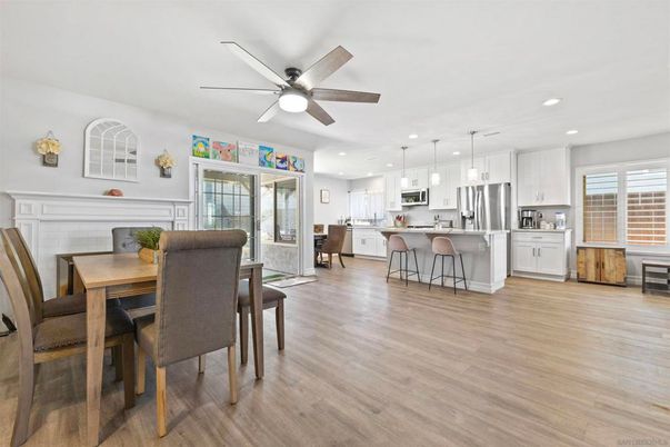 Dining room, Fireplace, Interior, Kitchen, Pendant Lights, Recessed Lighting, Stainless Steel Appliances, Wood Texture Flooring