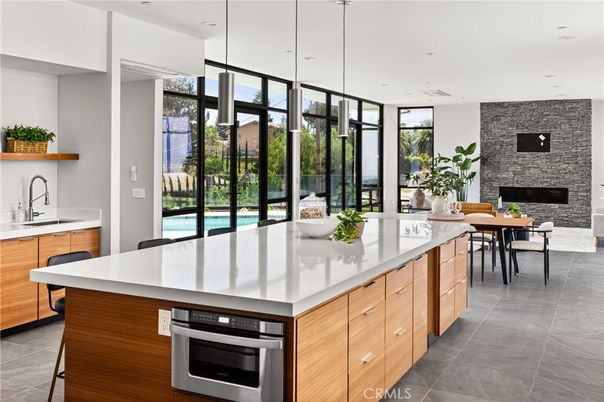 Dining room, Fireplace, Interior, Kitchen, Pendant Lights, Recessed Lighting, Stainless Steel Appliances, Stone Walls