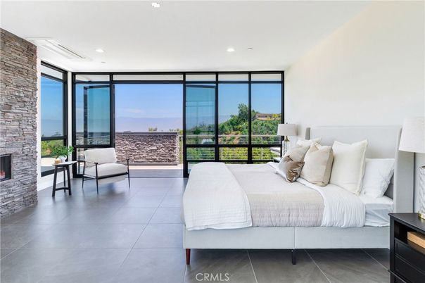Bedroom, Fireplace, Interior, Recessed Lighting, Stone Walls, Water