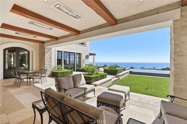 Exterior, Living room, Recessed Lighting, Stone Walls, Water, Wooden Beams