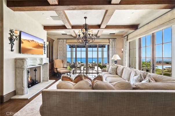 Chandelier, Fireplace, Interior, Living room, Recessed Lighting, Water, Wooden Beams, Wood Texture Flooring