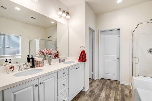 Bathroom, Dual Sink Vanities, Glass Shower, Interior, Recessed Lighting, Wood Texture Flooring