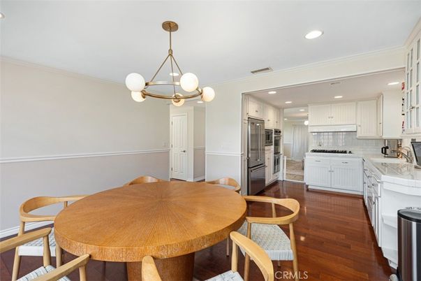 Dining room, Interior, Kitchen, Pendant Lights, Recessed Lighting, Stainless Steel Appliances, Tile Countertops, Wood Texture Flooring