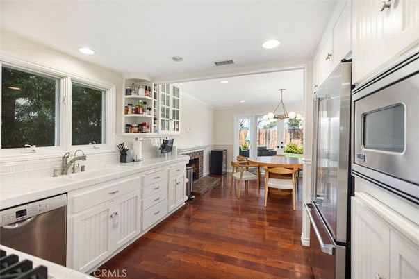 Dining room, Fireplace, Interior, Kitchen, Pendant Lights, Recessed Lighting, Stainless Steel Appliances, Tile Countertops, Wood Texture Flooring