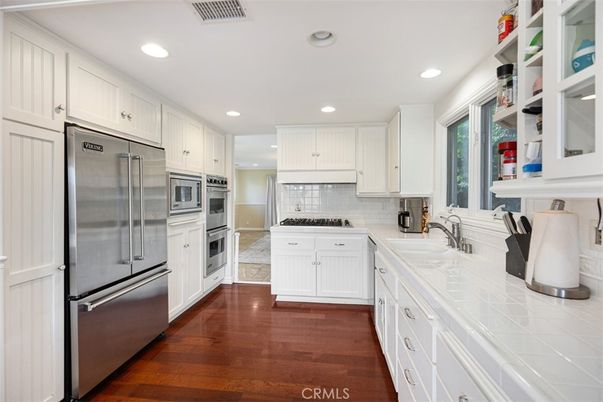 Interior, Kitchen, Recessed Lighting, Stainless Steel Appliances, Tile Countertops, Wood Texture Flooring
