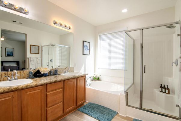Bathroom, Dual Sink Vanities, Glass Shower, Interior, Recessed Lighting, Wood Texture Flooring