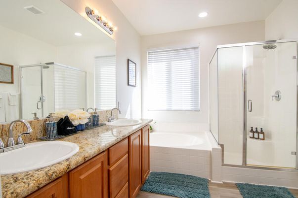 Bathroom, Dual Sink Vanities, Glass Shower, Interior, Recessed Lighting, Wood Texture Flooring