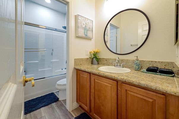 Bathroom, Dual Sink Vanities, Glass Shower, Interior, Recessed Lighting, Wood Texture Flooring