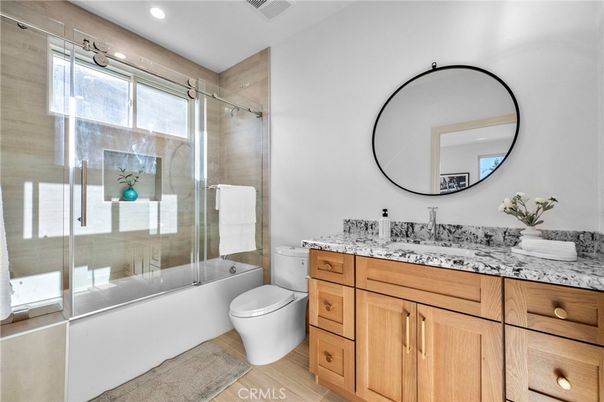 Bathroom, Dual Sink Vanities, Glass Shower, Interior, Recessed Lighting, Wood Texture Flooring