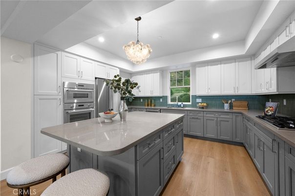 Chandelier, Interior, Kitchen, Pendant Lights, Recessed Lighting, Stainless Steel Appliances, Wood Texture Flooring
