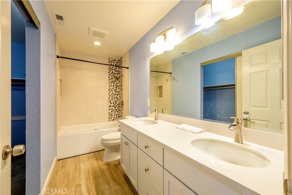 Bathroom, Dual Sink Vanities, Interior, Recessed Lighting, Wood Texture Flooring