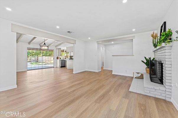 Empty room, Fireplace, Interior, Kitchen, Pendant Lights, Recessed Lighting, Wood Texture Flooring