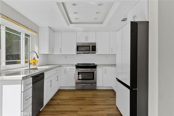 Interior, Kitchen, Recessed Lighting, Stainless Steel Appliances, Wood Texture Flooring