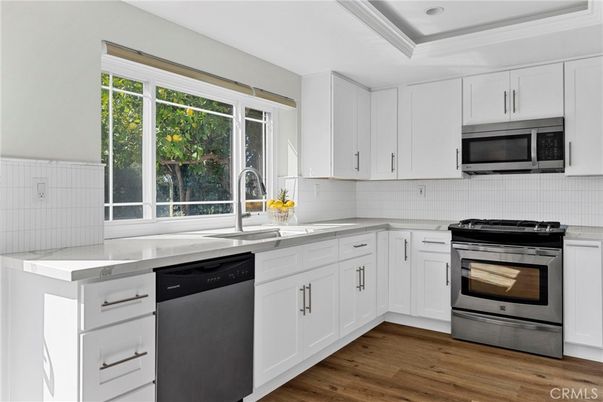 Interior, Kitchen, Recessed Lighting, Stainless Steel Appliances, Wood Texture Flooring