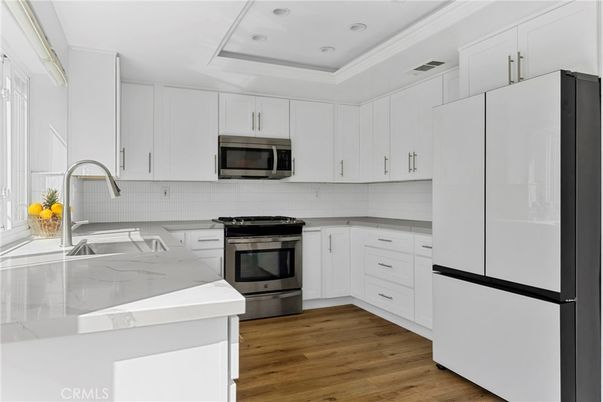 Interior, Kitchen, Recessed Lighting, Stainless Steel Appliances, Wood Texture Flooring