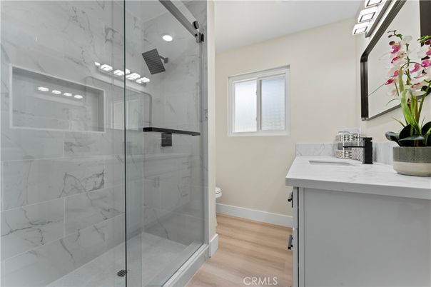 Bathroom, Glass Shower, Interior, Marble Walls, Wood Texture Flooring