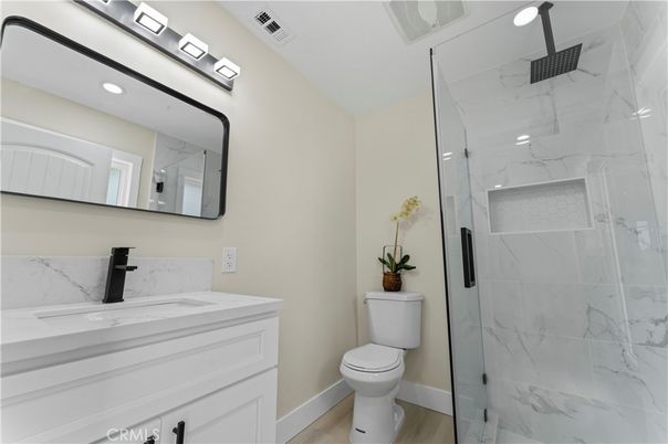 Bathroom, Glass Shower, Interior, Marble Walls, Recessed Lighting, Wood Texture Flooring