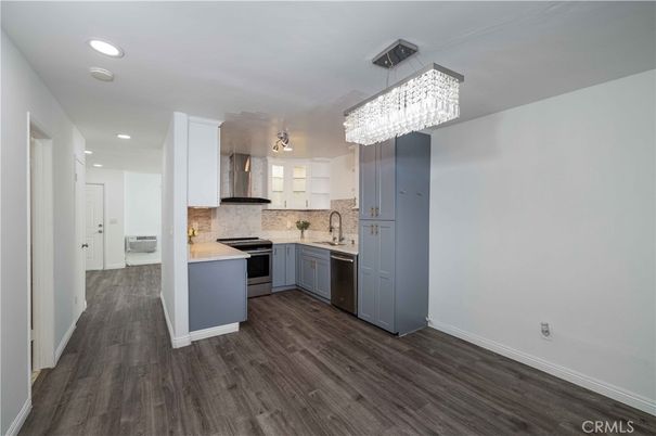 Chandelier, Interior, Kitchen, Recessed Lighting, Stainless Steel Appliances, Wood Texture Flooring