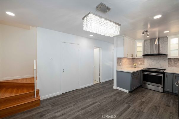 Chandelier, Interior, Kitchen, Marble Walls, Recessed Lighting, Stainless Steel Appliances, Wood Texture Flooring