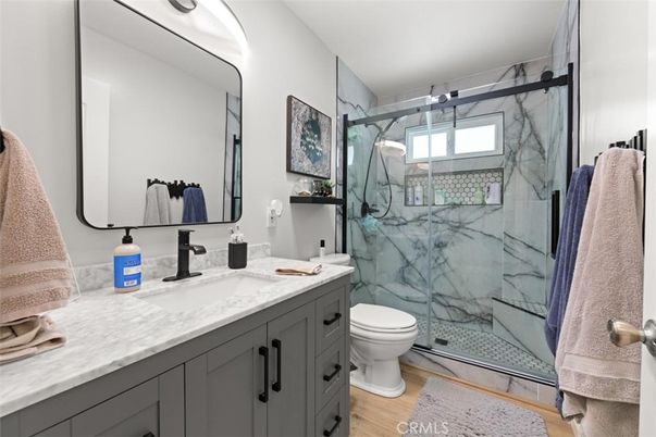 Bathroom, Glass Shower, Interior, Marble Walls, Wood Texture Flooring
