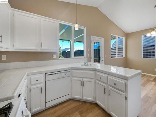 Interior, Kitchen, Pendant Lights, Tile Countertops, Wood Texture Flooring