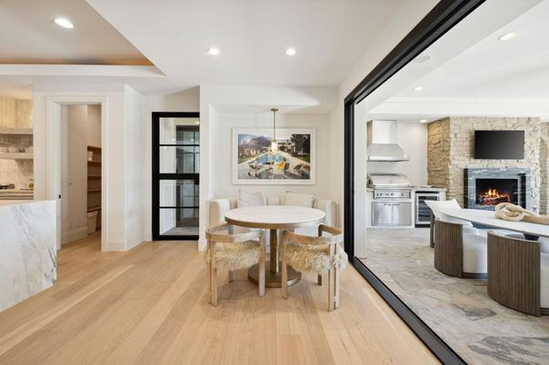 Dining room, Fireplace, Interior, Kitchen, Pendant Lights, Recessed Lighting, Stainless Steel Appliances, Stone Walls, Wood Texture Flooring