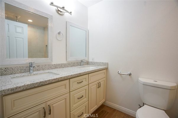 Bathroom, Dual Sink Vanities, Interior, Recessed Lighting, Wood Texture Flooring
